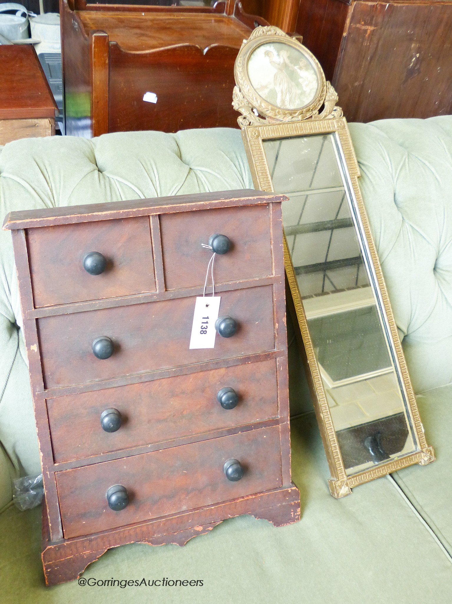 A Victorian style miniature pine chest of drawers. H-47cm, together with a gilt pier glass.